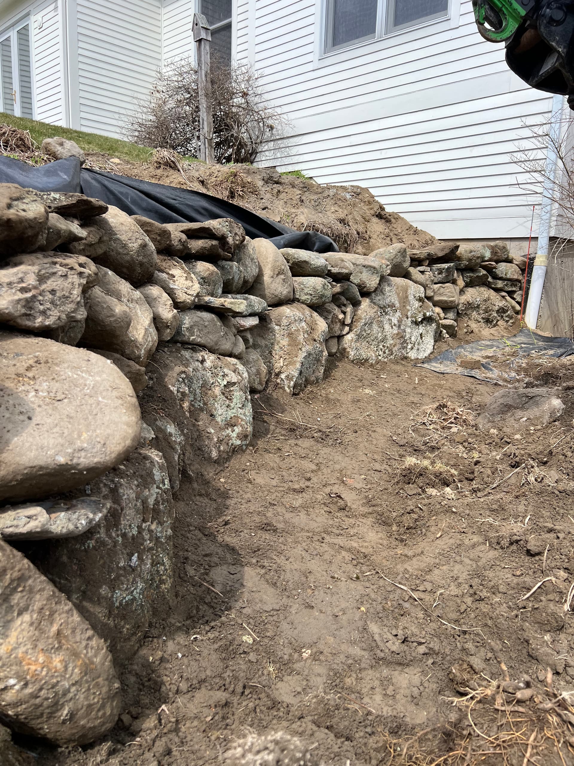 Crafting a Stone Retaining Wall with Precision