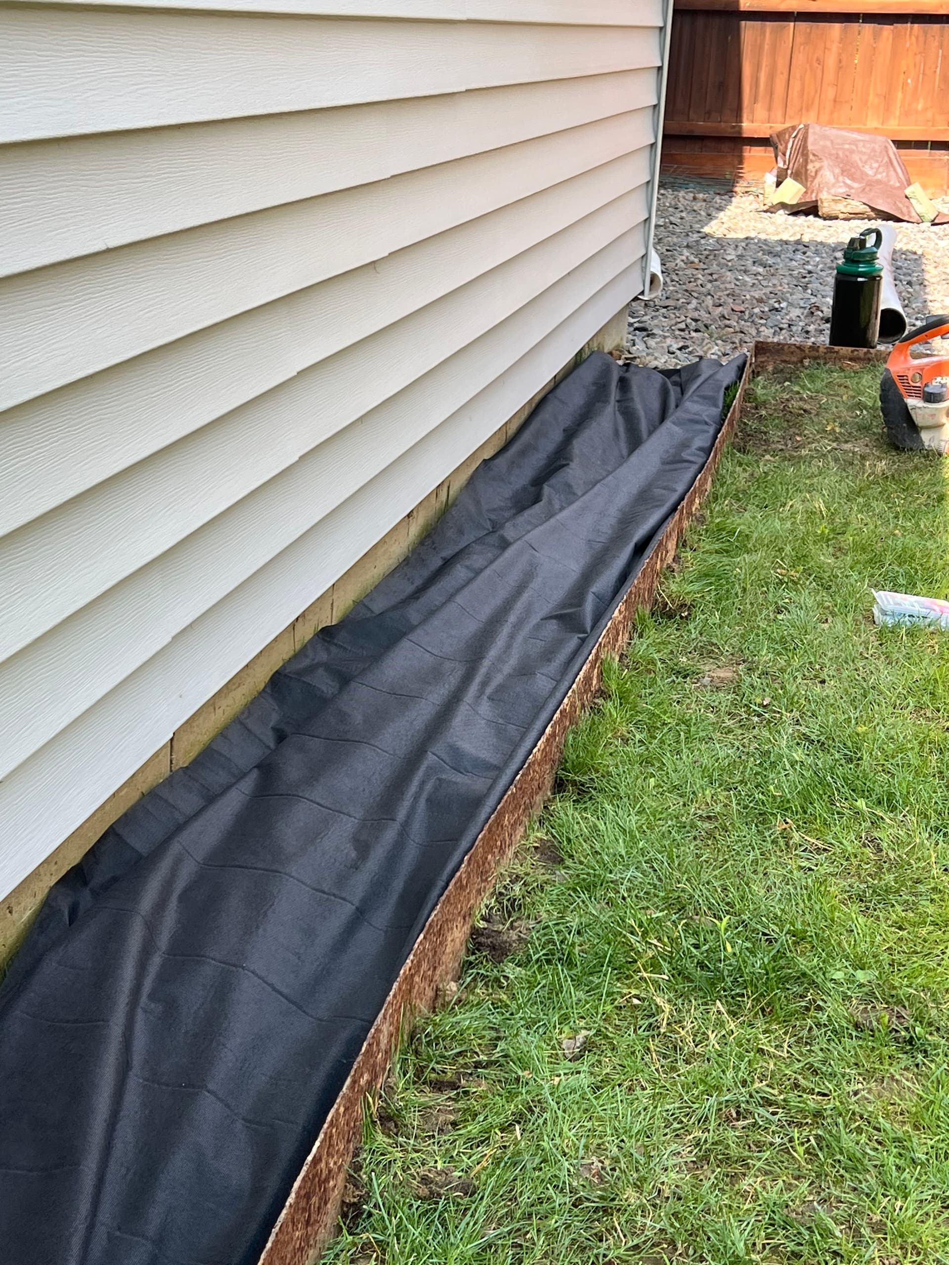 Gallery photos for Drainage Pipe and Stone Bed Installation Along Home Foundation: Image #1
